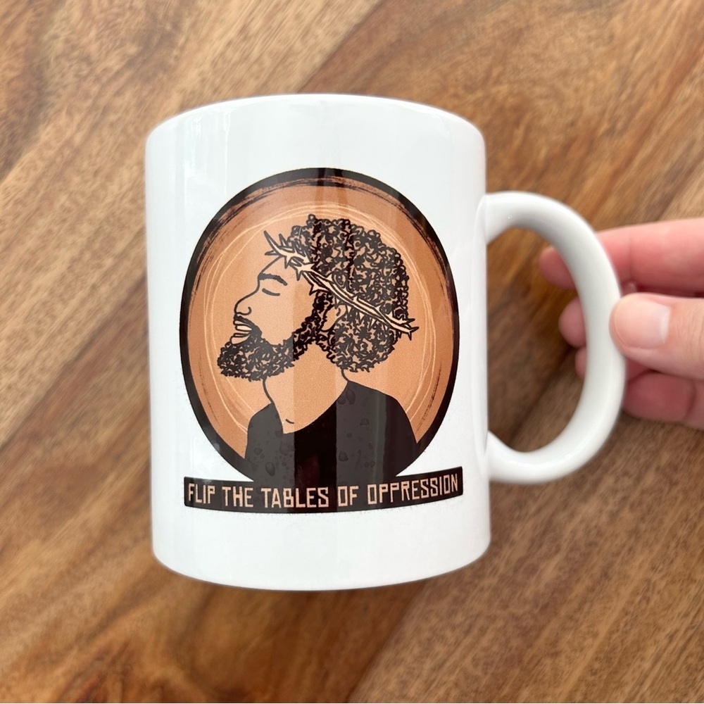 Jesus mug “flip the tables of oppression”